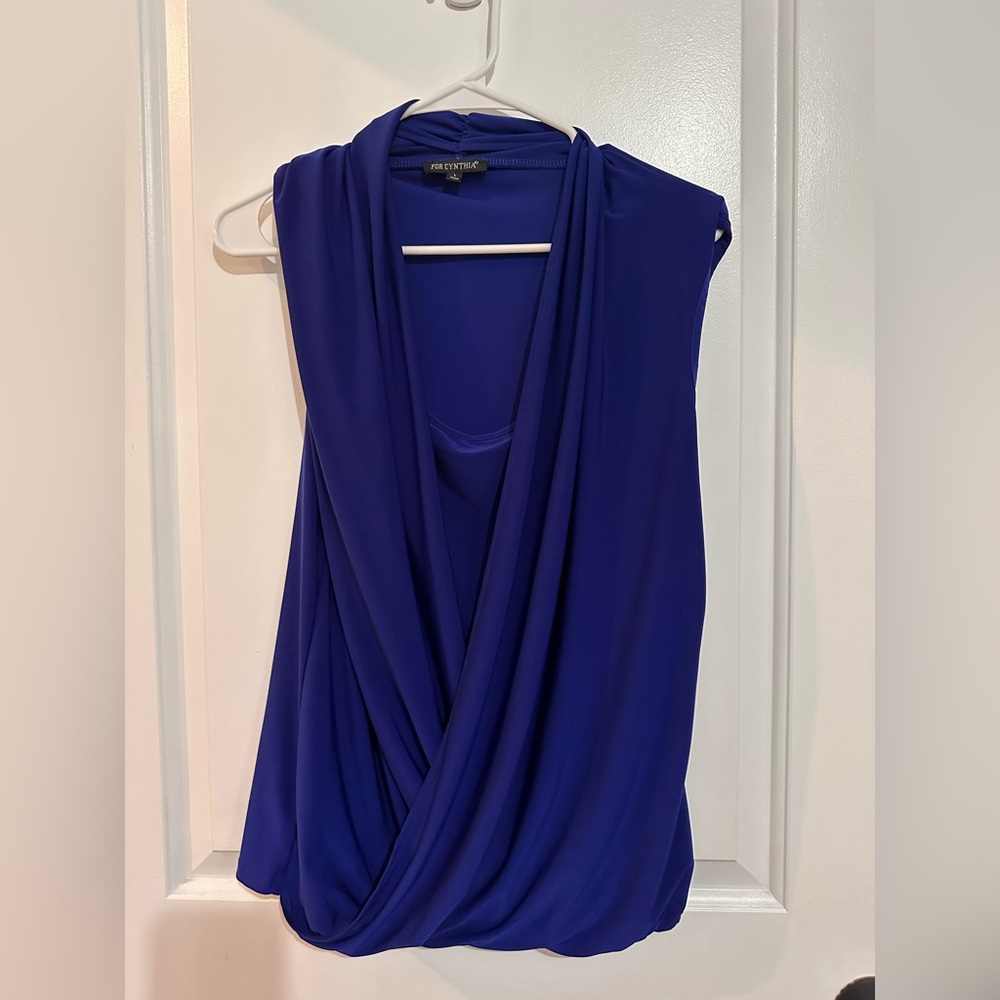 For Cynthia Royal blue women’s sleeveless blouse. Size large. Smoke free home.